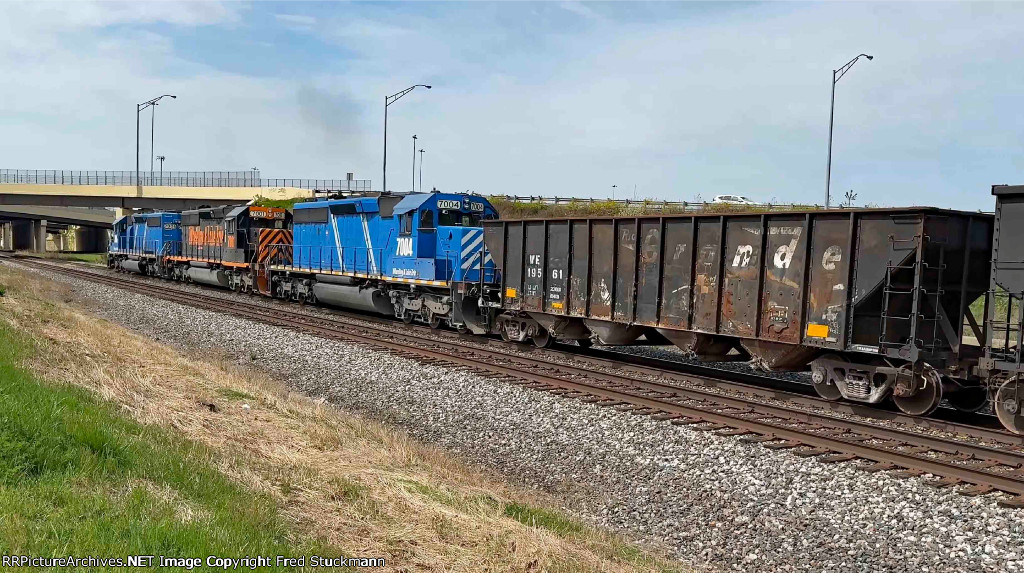 WE 7004 is now shoving past me with empties.
